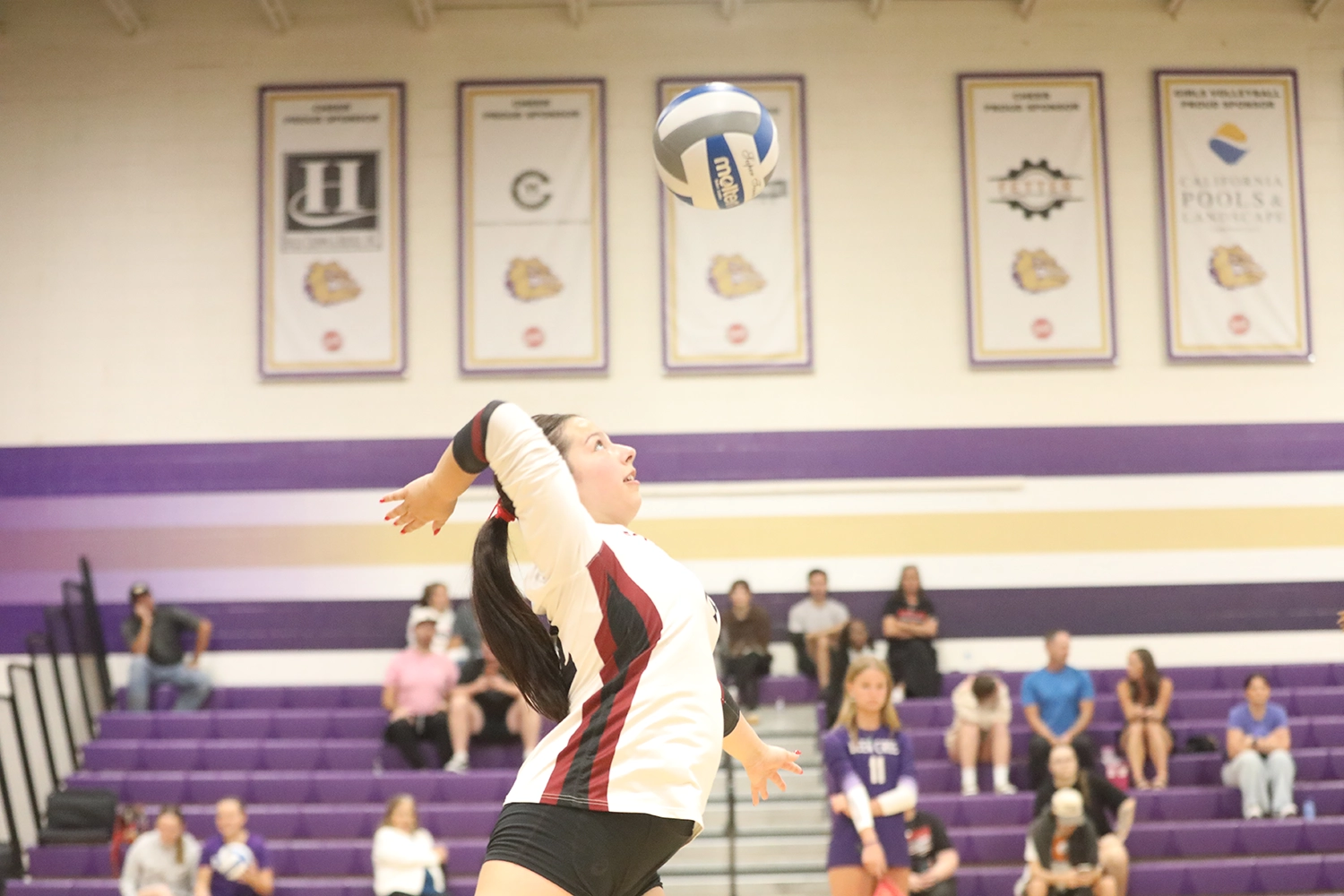 Spike the ball over the net