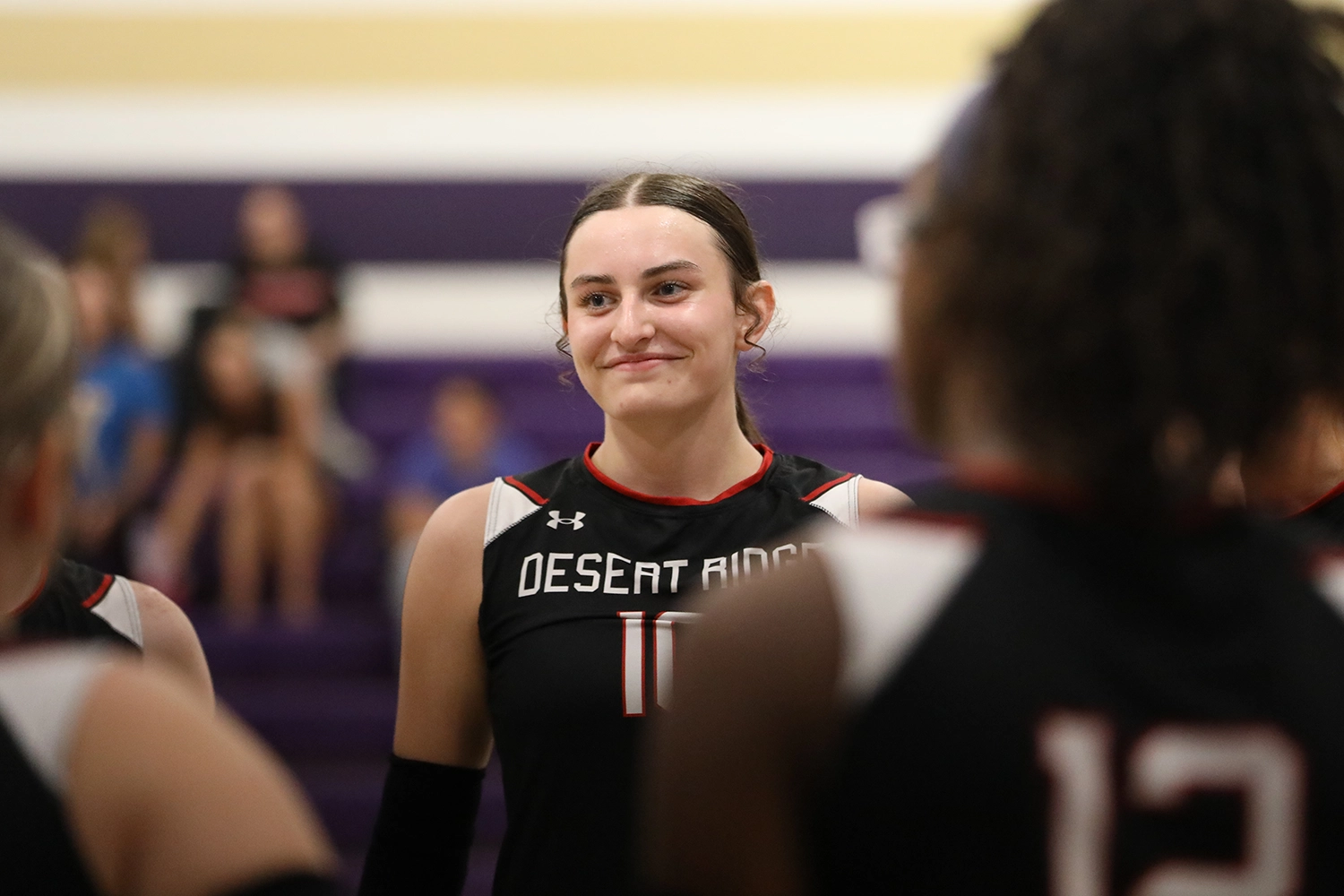 Smiling in the huddle